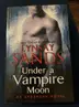 Book cover of Under a Vampire Moon