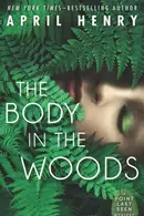 Book cover of The body in the woods