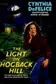 Book cover of The light on Hogback Hill